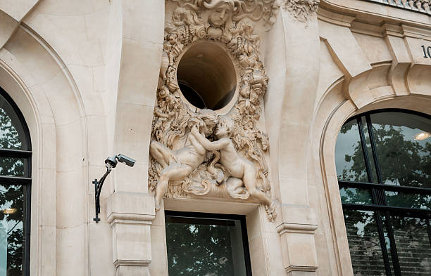 istock A tall building featuring a prominent statue adorning its side 2222230718