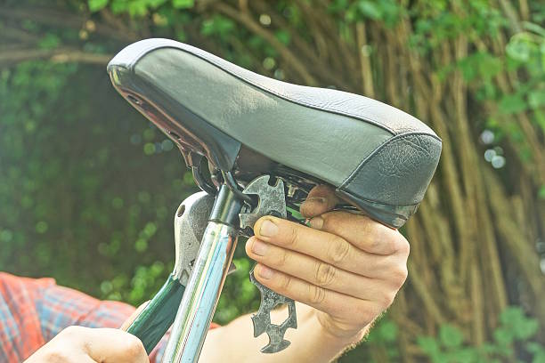 istock man hand holding black grey bicycle leather saddle 2222231724