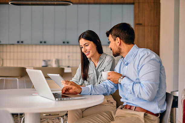 istock Business partners working together using laptop and digital tablet in office break room 2222232280