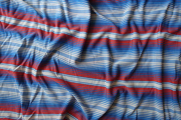 Background - draped blue, red and white striped fabric
