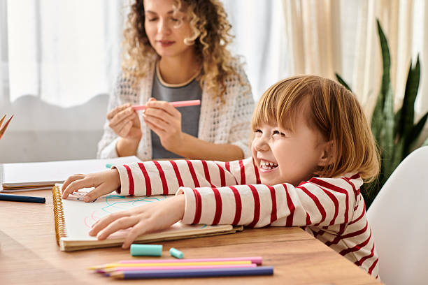 istock Curly mother and daughter joyfully engaging in creative activities at home 2222239035