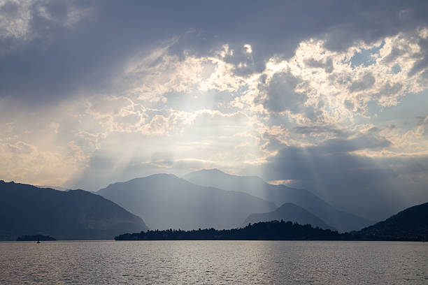 istock Sun Rays Breaking Through Clouds Above Peaceful Mountain Landscape 2222240046