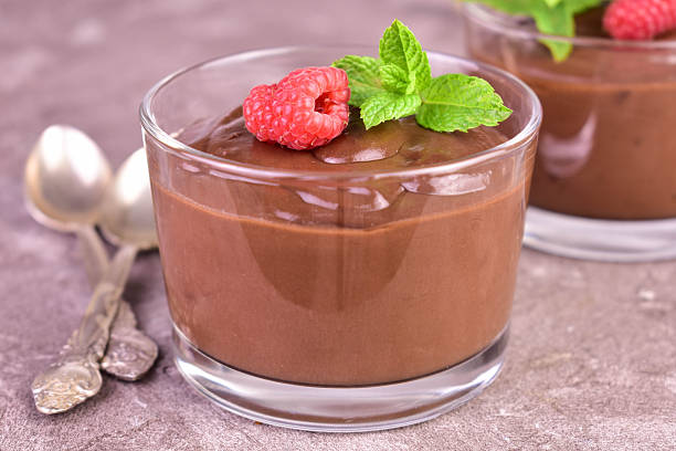 istock Chocolate pudding in a glass decorated with raspberries and mint. Close-up. 2222242443