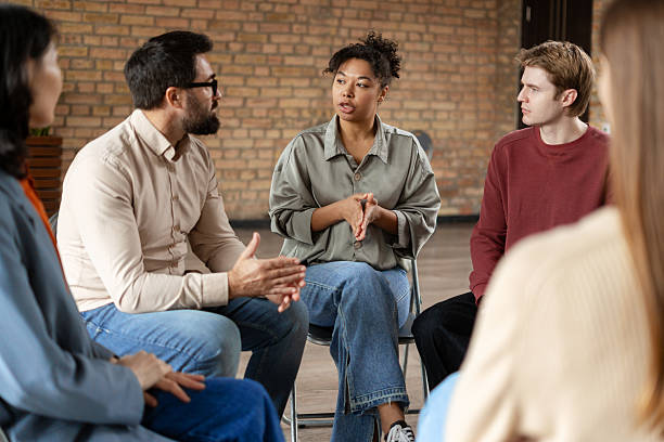 istock Diverse group of people sharing during a group therapy session 2222246044