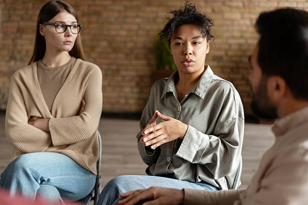 istock Young woman sharing her story during group therapy session 2222246067