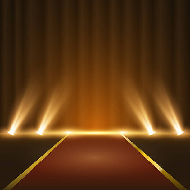 istock Bright gold award stage with spotlight beams and red carpet entrance. Abstract luxury platform with 3D shine, suitable for celebration backgrounds, branding, or special occasion design. 2222248147