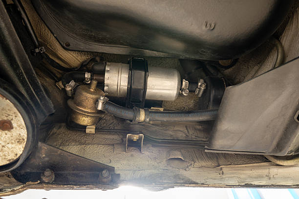 istock Automotive Fuel Pump Installation Process Under the Vehicle Chassis for Optimal Performance 2222250719