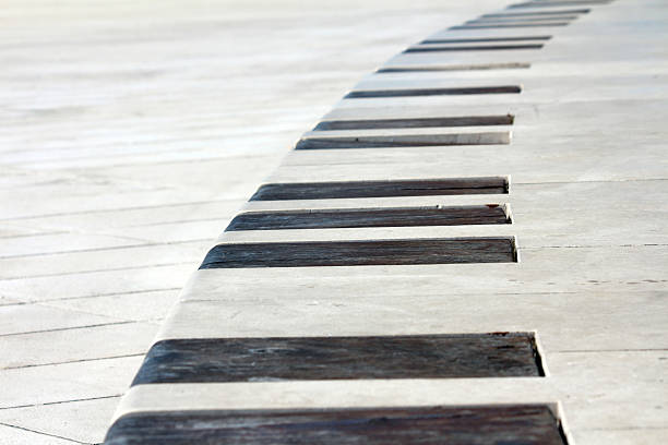 istock Modern concrete bench with dark wooden slats in geometric pattern 2222250796