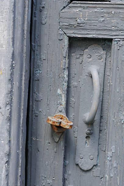 istock Old wooden door with a lock and a rusty bolt, 2222251065