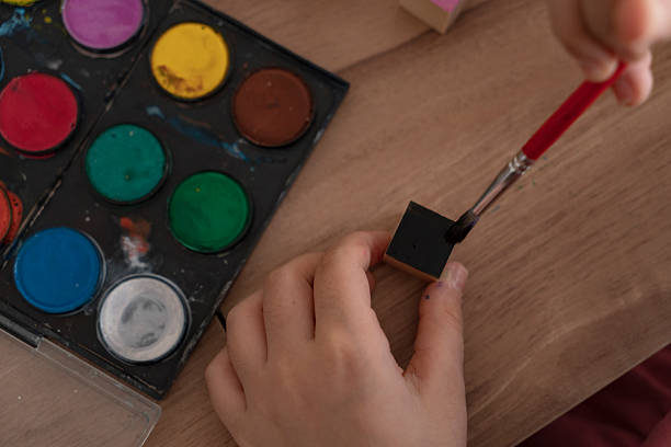 istock Girl painting cubes 2222251802