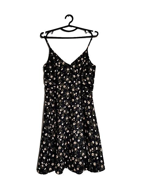 istock Black white floral print thin straps mini dress on hanging isolated on white solid background. Botanical print fit and flare sleeveless chiffon summer sundress. Women's clothes, fashion, style, design 2222257471