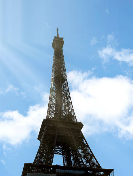 Paris Eiffel Tower, Iconic Paris, France Landmark against Blue Skies and Suns Rays