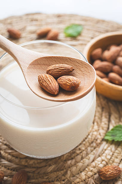 Almond milk and almonds. Plant milk.