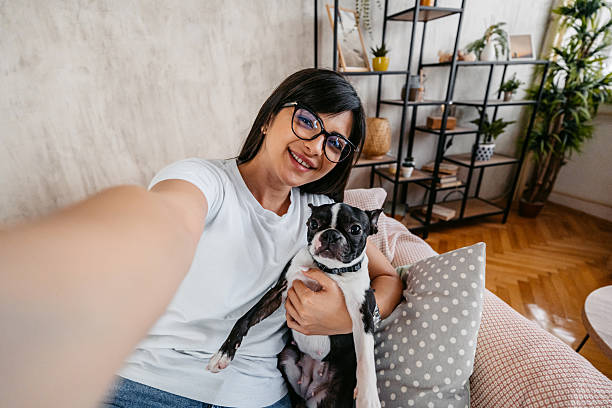 istock Young Woman Taking Selfies With Her Boston Terrier Dog 2222263678
