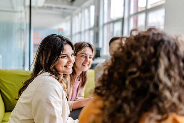 istock Group of young professionals discussing ideas in a modern office setting during a productive work session 2222263808