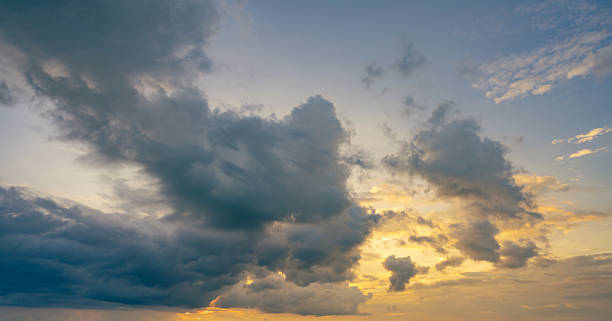 istock Dramatic overcast sky panorama with gray storm clouds during golden hour sunset creating moody atmospheric background for climate change awareness campaigns and emotional weather storytelling content 2222263953