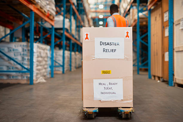 A labeled box sits in a warehouse, marked with 'Disaster Relief' and 'Meal, Ready-To-Eat Individual,' demonstrating organized logistics and the importance of humanitarian aid packaging for global emergency needs.