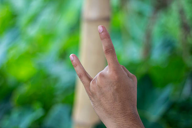 istock A black-skinned boy shows his two finger 2222264515