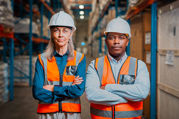 istock Warehouse Workers in Safety Gear Standing Confidently in Storage Facility 2222265208