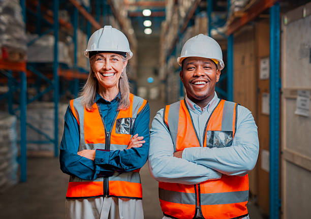 istock Warehouse Workers in Safety Gear Posing in Industrial Storage Facility 2222265217