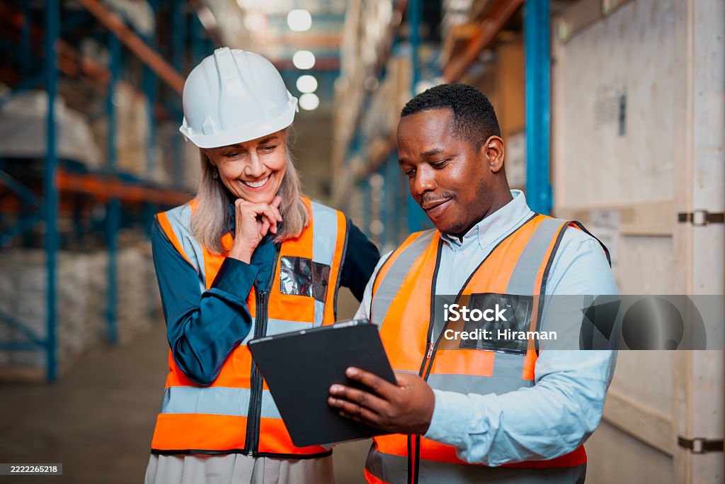 Employees In Warehouse Warehouse Logistics Workers Collaborating With A Digital Device In A ...