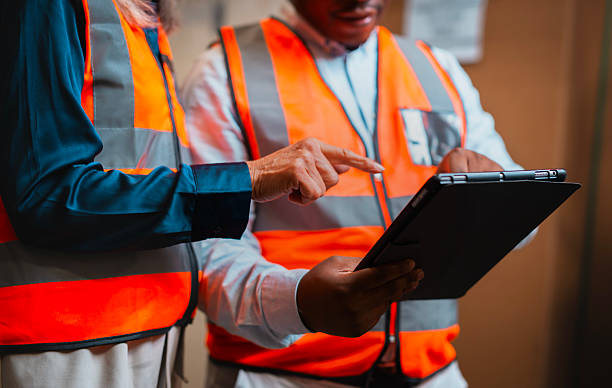 istock Warehouse Team Collaborating on Digital Tablet for Real-Time Inventory and Logistics Management 2222265224