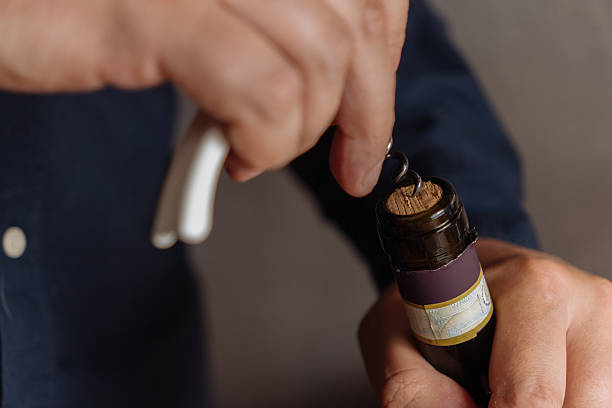 istock Opening a bottle of wine 2222267073