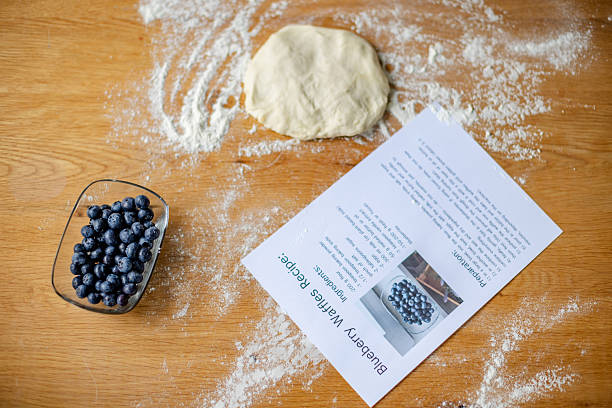 istock Woman enjoys fresh blueberries while preparing healthy recipe in cozy kitchen setting 2222267255