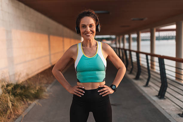 istock Confident Woman Smiling While Posing for the Camera 2222268222