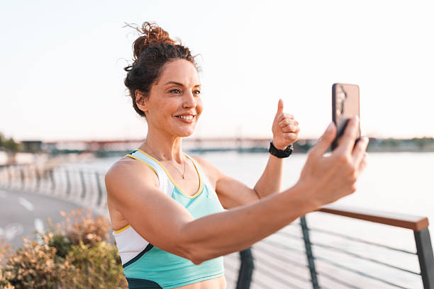 istock Smiling Athlete Taking Selfie by the Water 2222268812