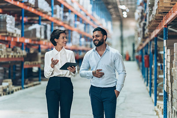 istock Two business person talking in warehouse 2222272003