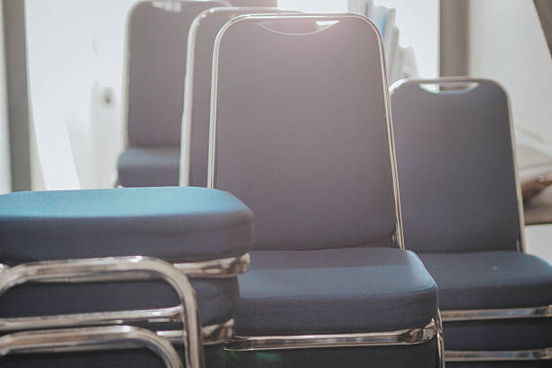 close up of stacked blue chairs