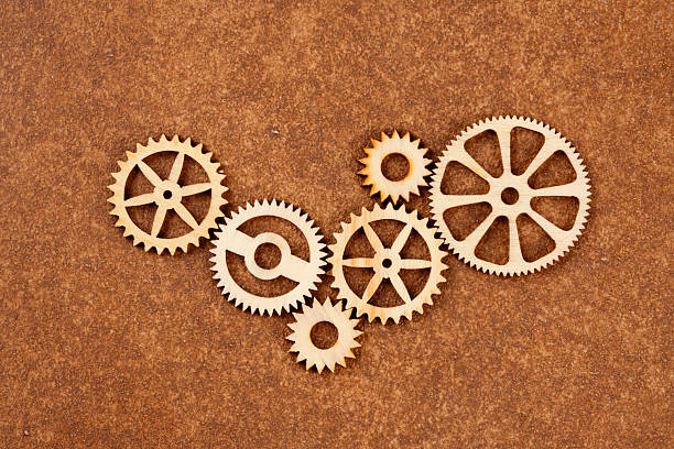 Set of spinning gears on wooden table