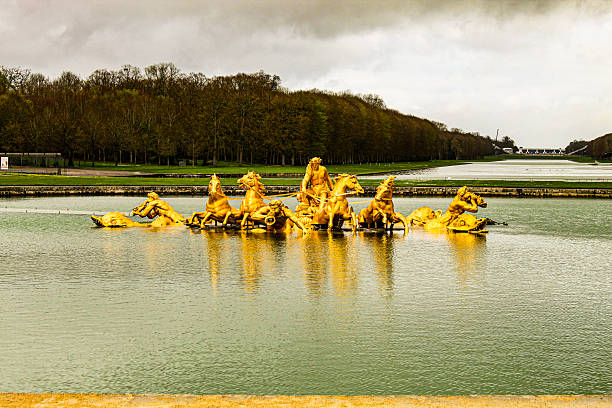 Image of the famous Fountain of Apollo in the public Gardens of Versailles, which are free ticket. Image taken in April 2024