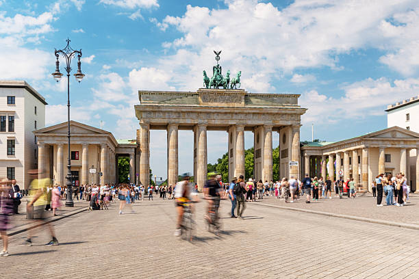 istock Iconic Brandenburg Gate with Crowds Under a Sunny Blue Sky in Berlin 2222277129