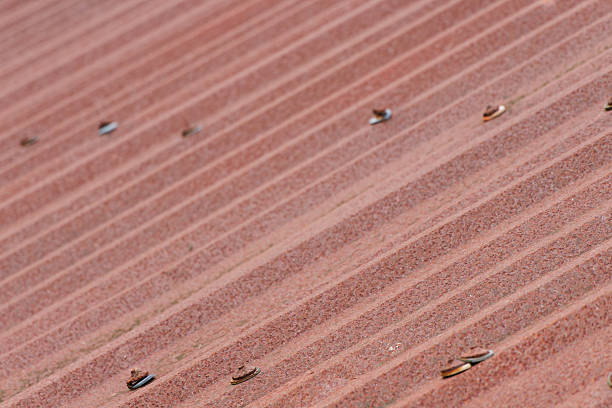 Detailed macro shot of an old rusty corrugated metal roof, highlighting its textured surface and weathered appearance ideal for backgrounds.