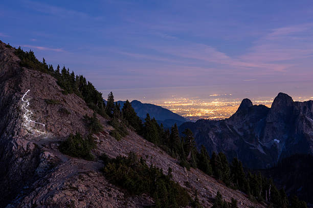 Alpine glow on mountain peak and light streak from sparkler, British Columbia Coastal Ranges