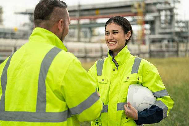 istock Engineer worker hand shaking to colleagues team for success work at construction site of petroleumchemical industry or refinery oil plant factory 2222282672