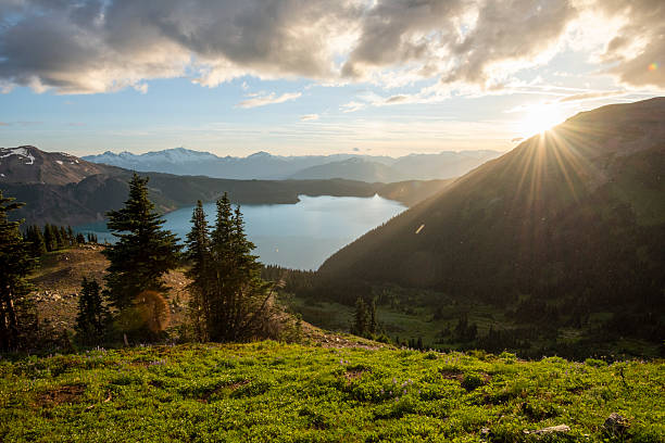 istock Sunrise over mountains, forest and lake, B.C. 2222285677