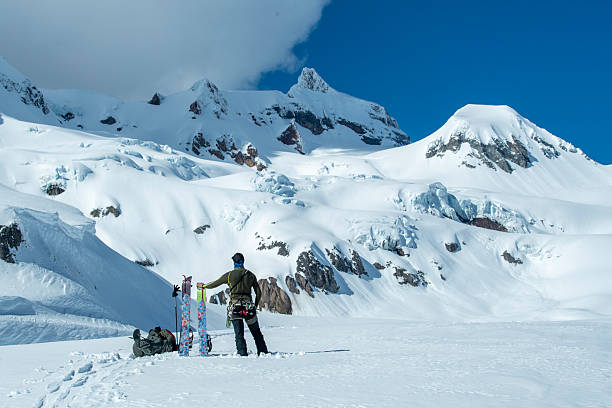 istock Backcountry splitboarder stands on mountain top 2222288432