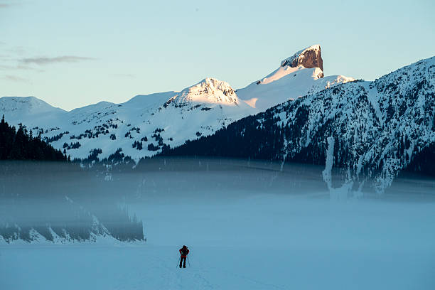 istock Backcountry splitboarder ascends mountain at dusk 2222289582
