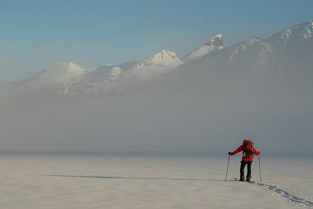 istock Backcountry splitboarder ascends mountain at dusk 2222289615