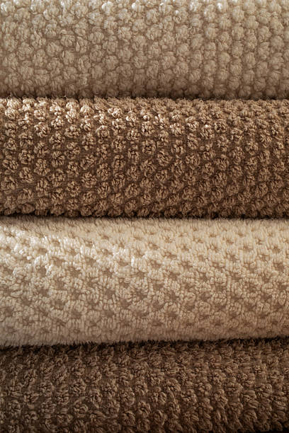 istock Stack of towels in neutral colors texture as a background. Fabric bathroom accessories for hygiene, spa and skin care. 2222291828