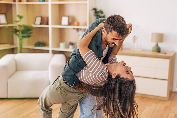 istock Happy couple dancing and having fun at home 2222292716