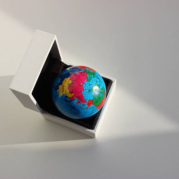istock Europe, Asia, China and Canada Visible on a Small Globe Lying in a Box 2222293694
