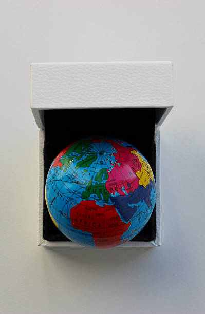 istock Flat Lay View of Earth Model inside Gift Case Isolated on White Surface 2222293699