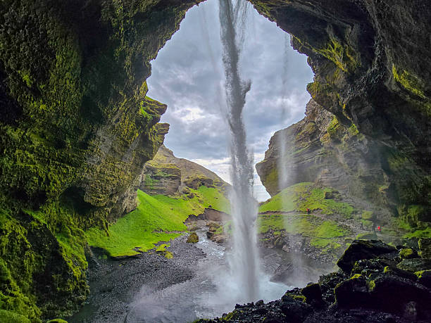 istock Kvernufoss waterfall cascading through lush green cliffs in Iceland 2222296340