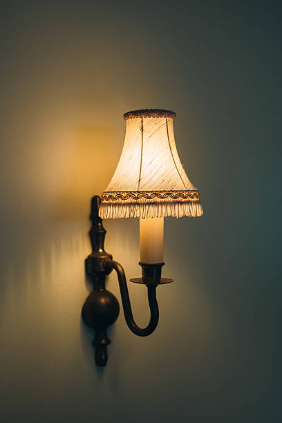 istock Vintage Wall Sconce with Elegant Shade Illuminating a Cozy Interior Environment 2222301420