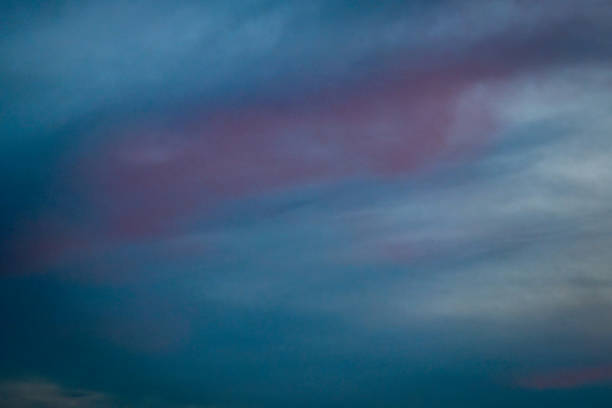 Light and dark blue windy sunset cloudy heaven sky color