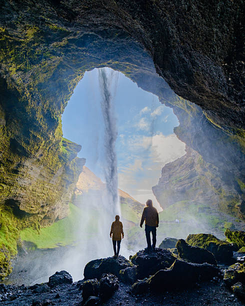 istock Majestic waterfall cascading through cliffside cave in Iceland at sunrise 2222304215
